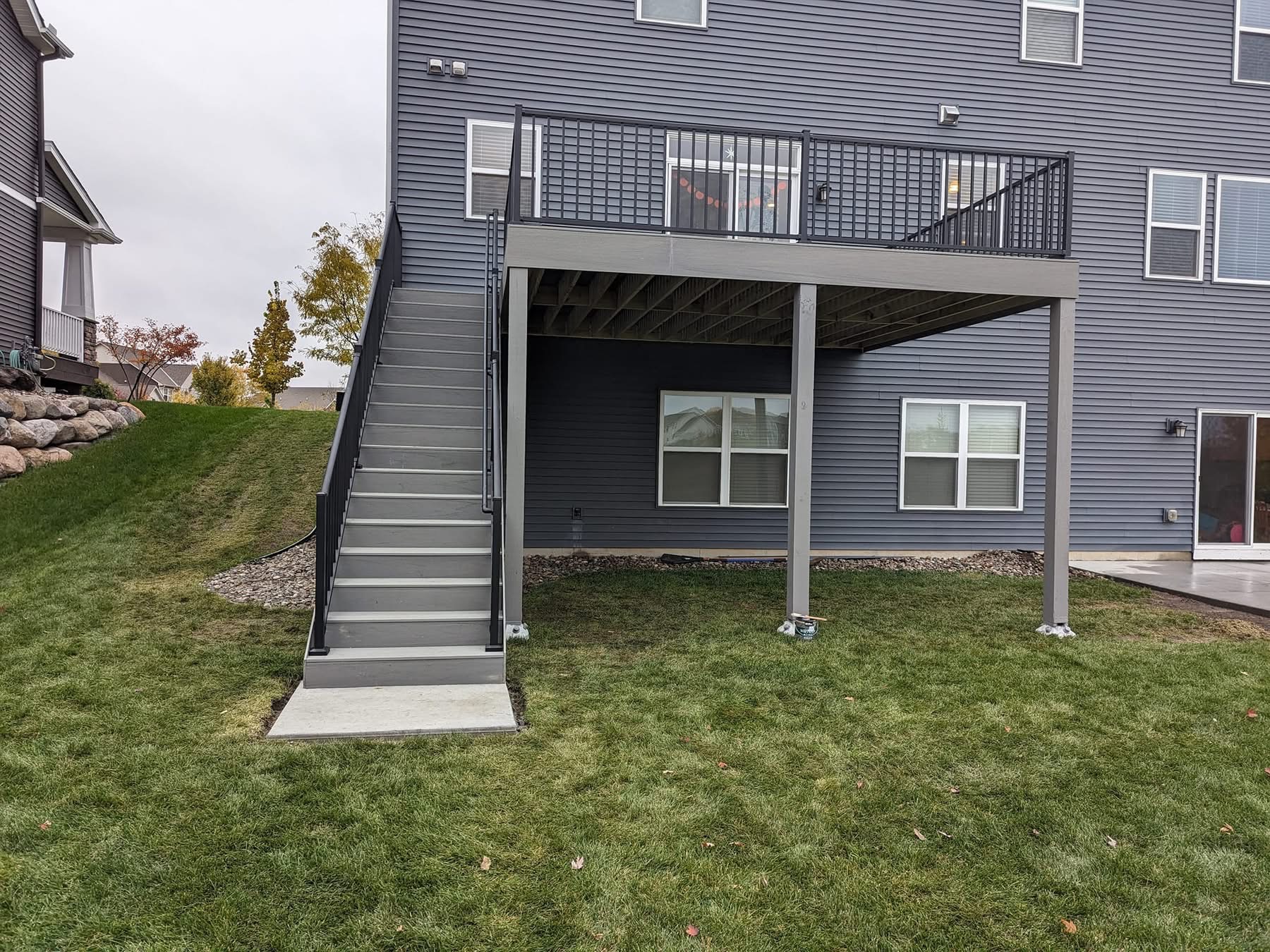 Deck'd Out LLC elevated composite deck with staircase