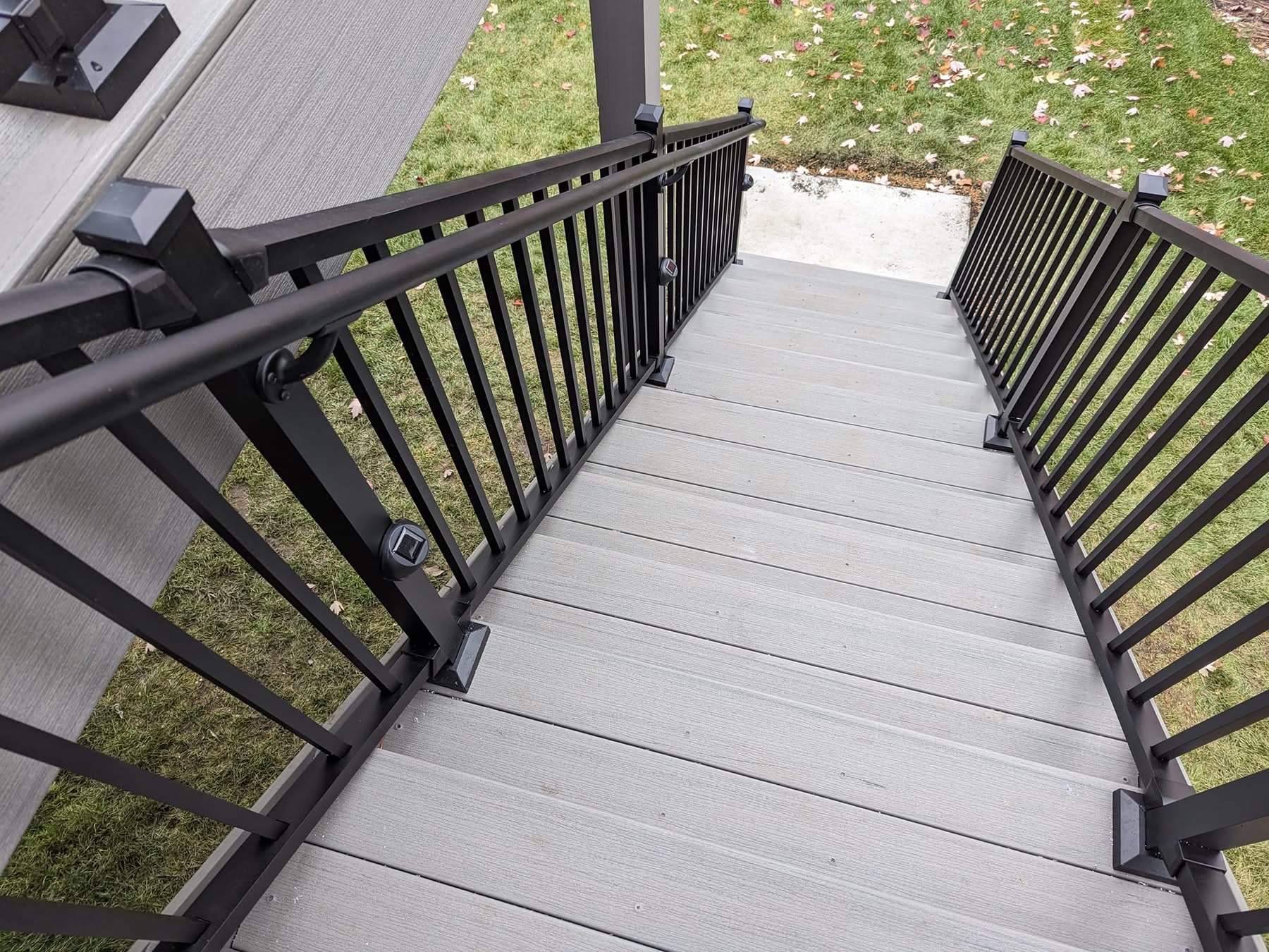 Deck'd Out LLC composite stair treads with black aluminum railing